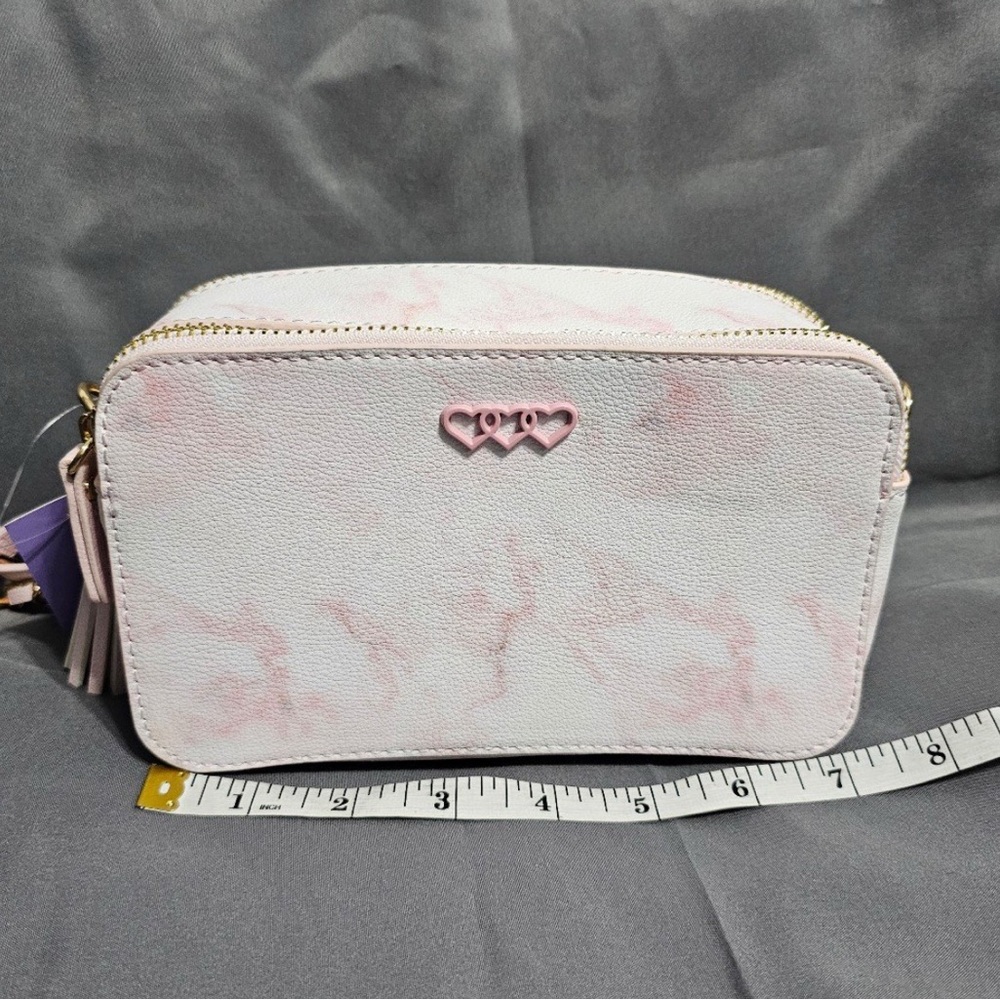 Claire’s sold out pink and white marbled crossbody bag with heart detail